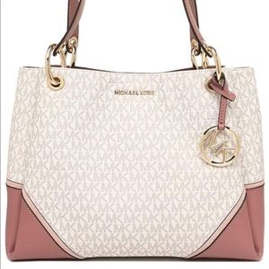 Michael Kors “New” has tags never been used.